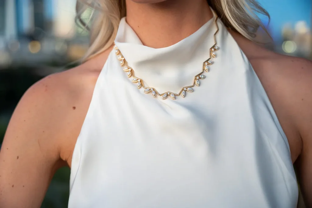 Diamond necklace in yellow gold photographed on an Austin rooftop, Eterna Jewels