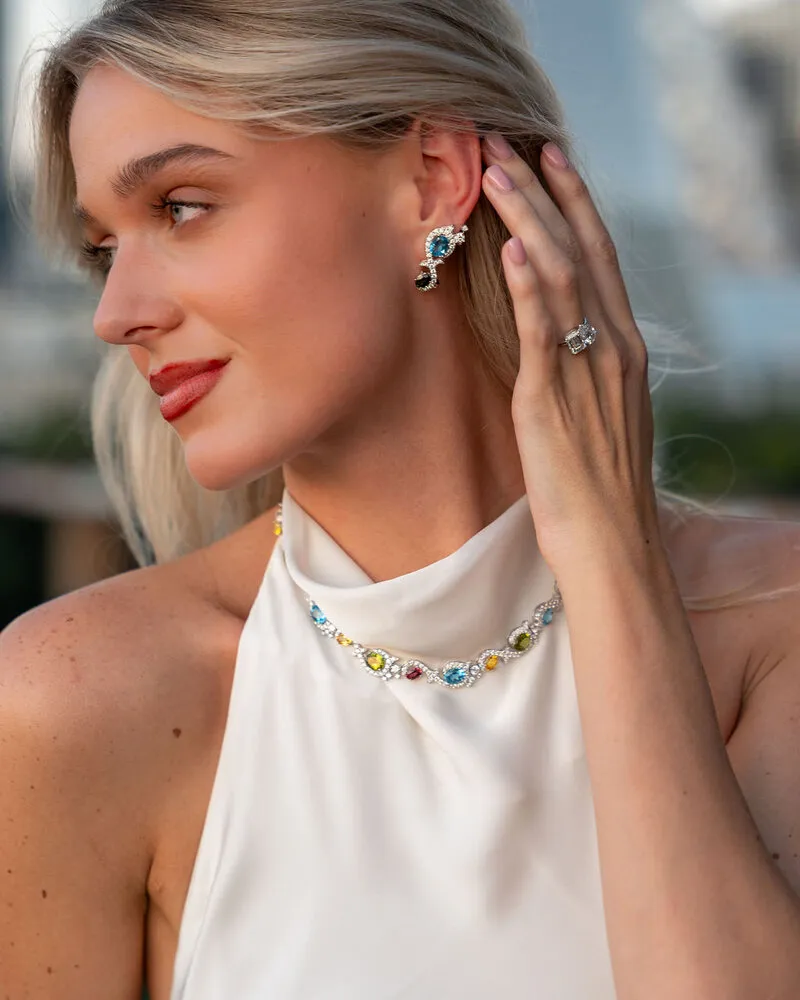 Model wearing gemstone drop earrings and a gemstone necklace, Eterna Jewels Austin