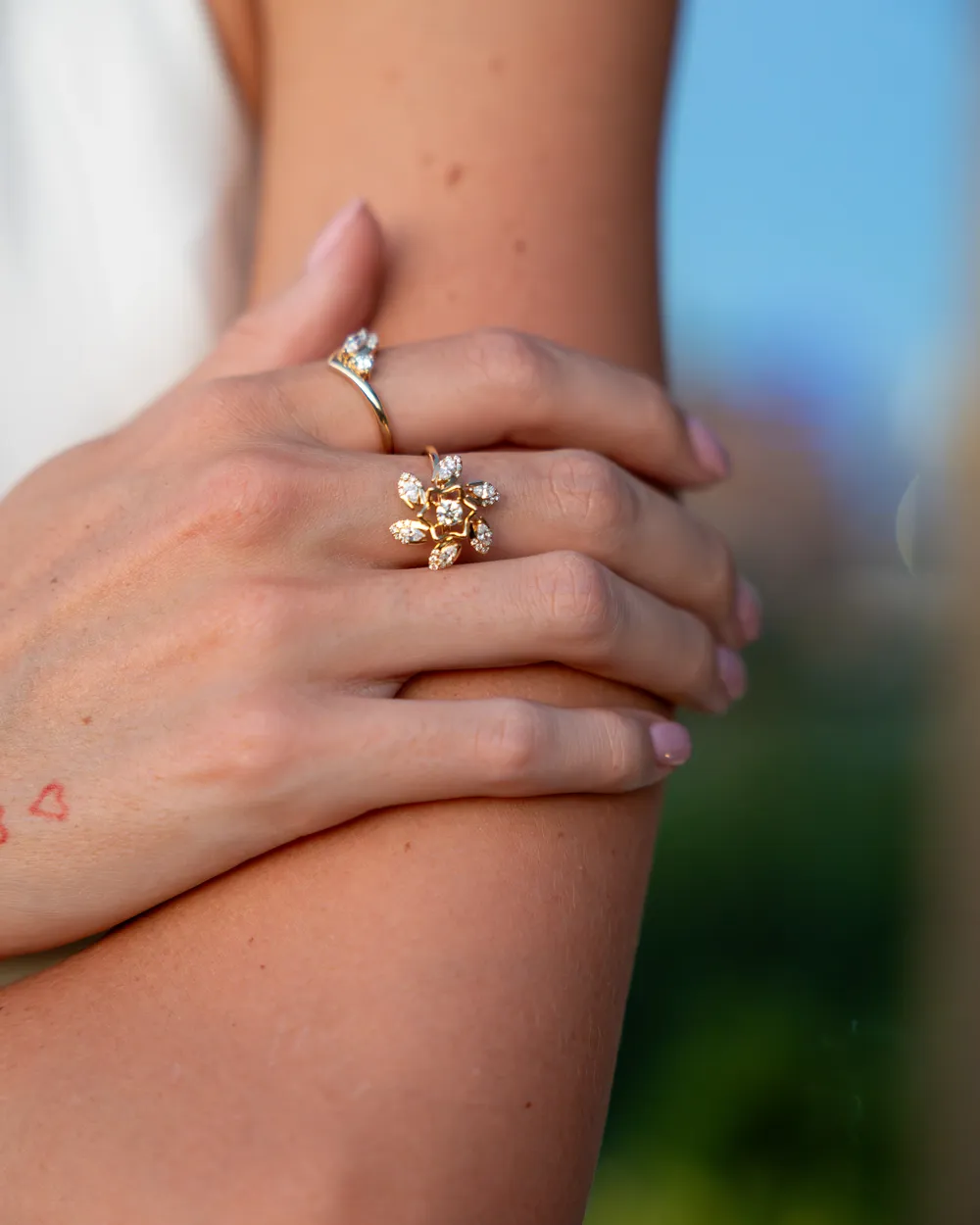 Two diamond rings in yellow gold worn on one hand